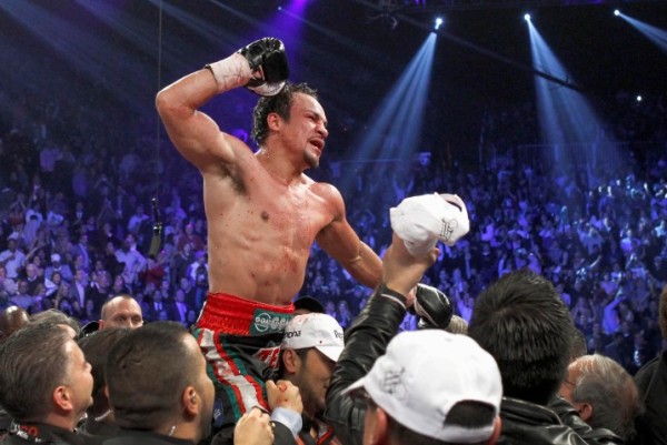 Juan Manuel Marquez of Mexico celebrates his 6th round knock out victory over Manny Pacquiao of the Philippines during their welterweight fight at the MGM Grand Garden Arena in Las Vegas